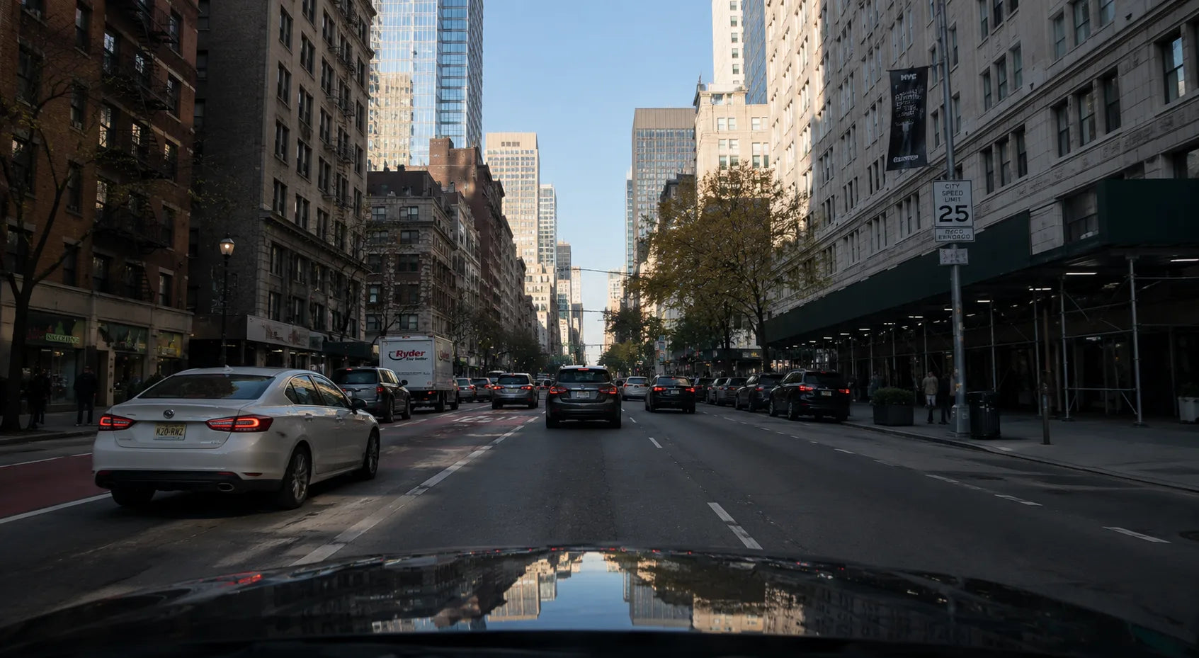 Daytime city street seen from the driver's seat