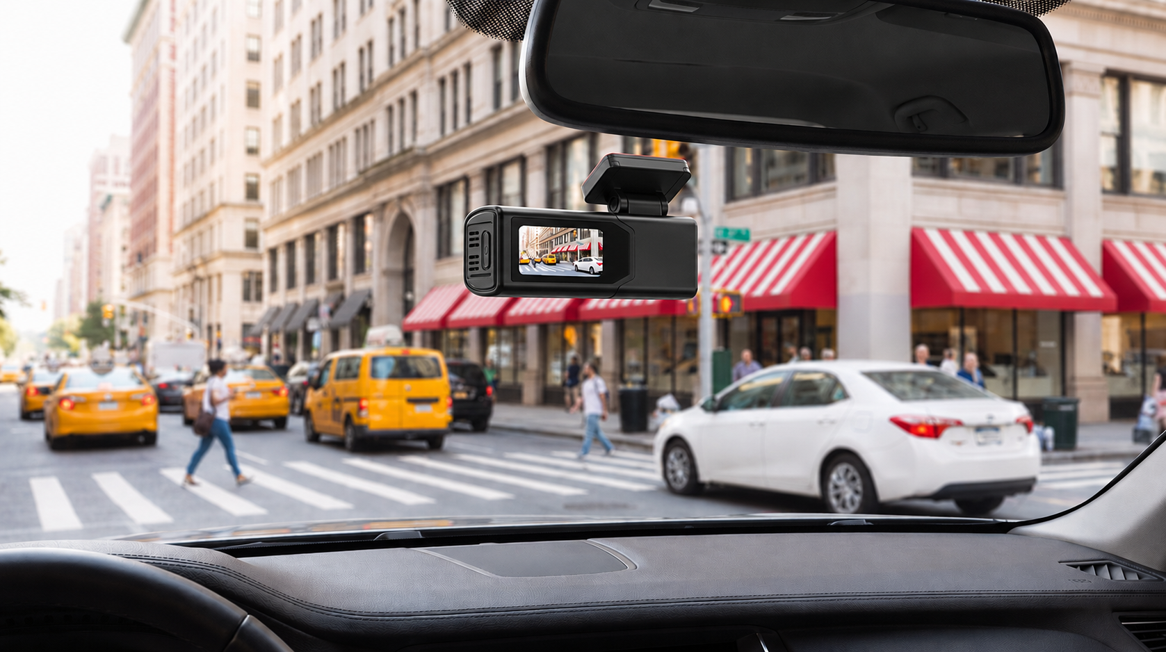 Plainview One on the windshield with its power cord attached, screen showing the road ahead